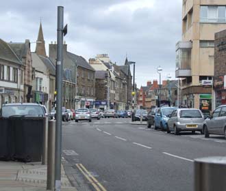 Image looking east along dalkeith high street, disabled parking, one on imediated left and two the far side of the Zebra Crossing