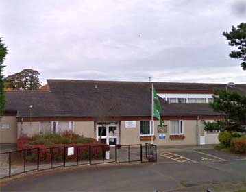 Entrance showing front door with disabled parking bay to the right